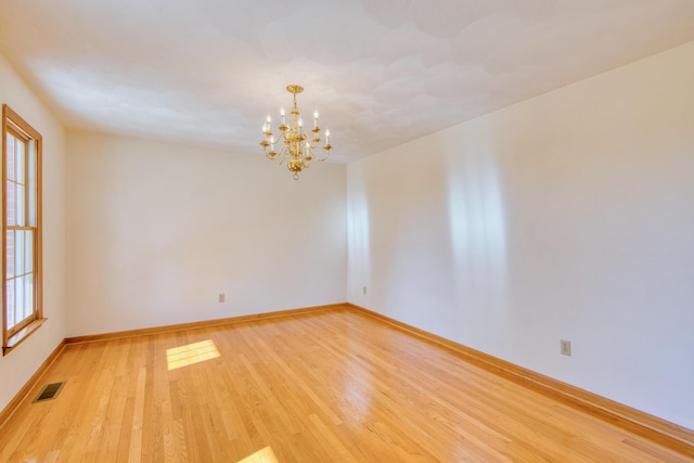 195 Showalter Rd NW, Willis, VA 24380 - spare room featuring light wood-style flooring and a chandelier