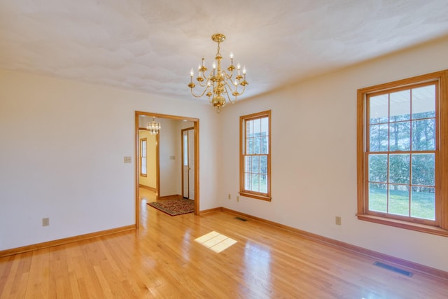 195 Showalter Rd NW, Willis, VA 24380 - empty room featuring a chandelier and light wood-type flooring