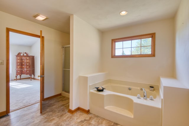 195 Showalter Rd NW, Willis, VA 24380 - bathroom featuring a bath, a shower with shower door, and recessed lighting