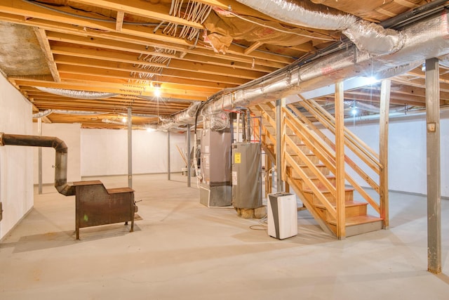 195 Showalter Rd NW, Willis, VA 24380 - unfinished below grade area featuring water heater and stairway