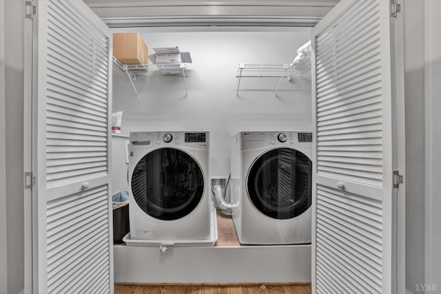 laundry room with independent washer and dryer and laundry area