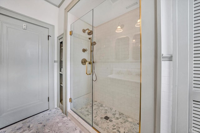 full bathroom with a shower stall, visible vents, and ornamental molding