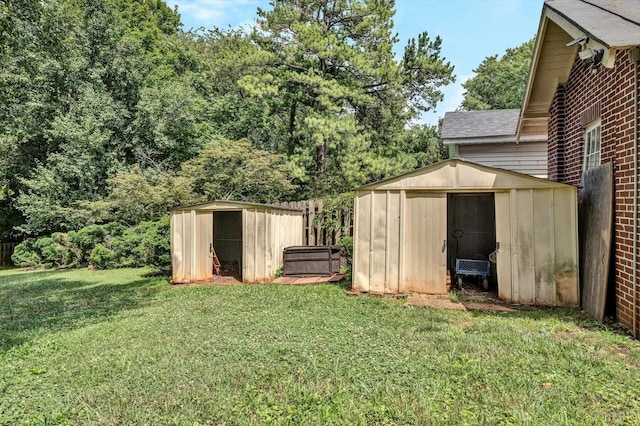 view of yard featuring an outdoor structure and a shed