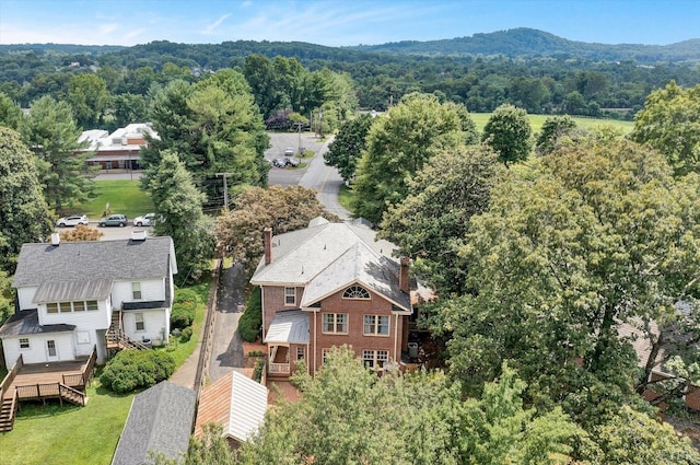 drone / aerial view featuring a forest view