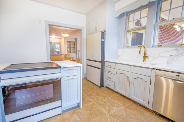 kitchen with decorative backsplash, a sink, and white appliances