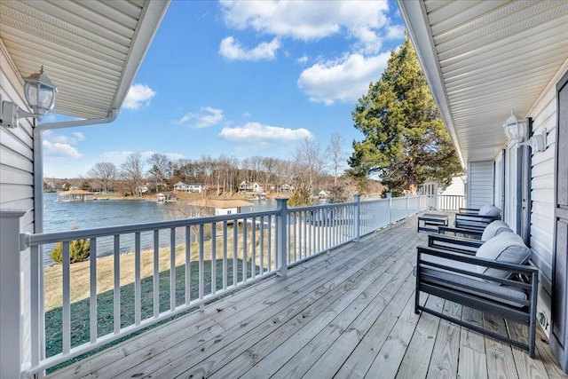 wooden deck featuring a water view