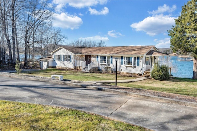 ranch-style house with a front yard and an attached garage