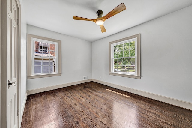 2619 Carolina Ave SW, Roanoke, VA 24014 - unfurnished room featuring dark wood-style floors, ceiling fan, and baseboards