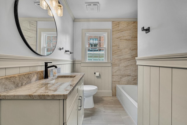2619 Carolina Ave SW, Roanoke, VA 24014 - full bath with vanity, toilet, a bathtub, ornamental molding, and a wainscoted wall