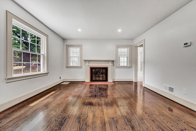 2619 Carolina Ave SW, Roanoke, VA 24014 - unfurnished living room with healthy amount of natural light, a fireplace, wood finished floors, baseboards, and recessed lighting