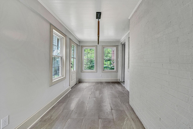 2619 Carolina Ave SW, Roanoke, VA 24014 - unfurnished sunroom with baseboards
