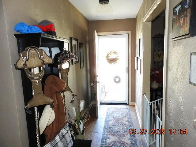 entryway with wood finished floors