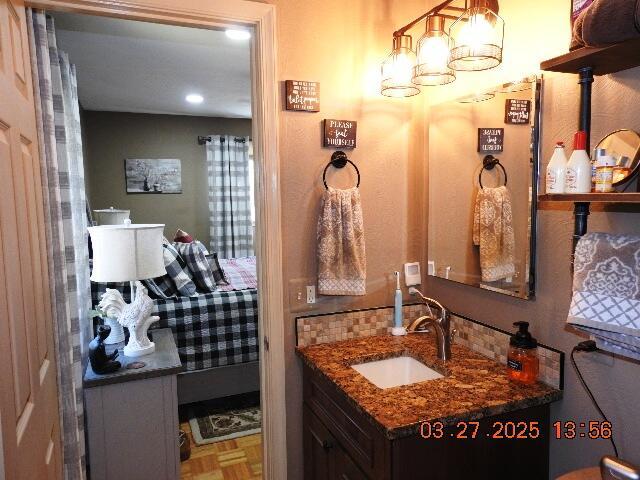 bathroom with vanity and recessed lighting