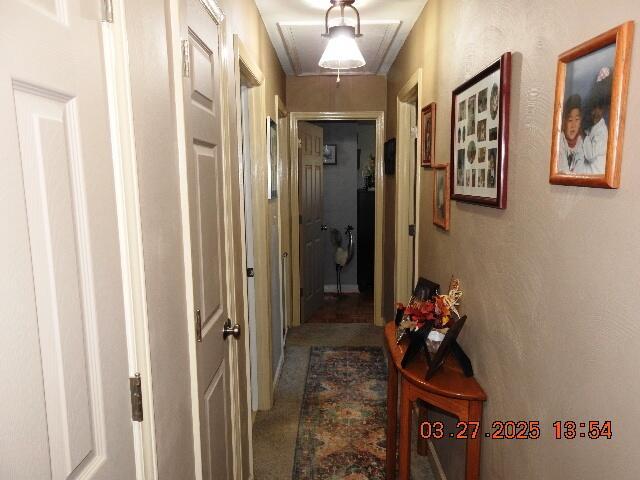 hall featuring attic access