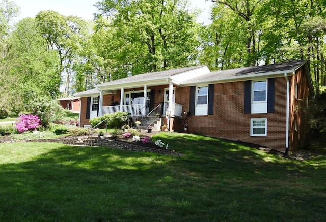 ranch-style home with brick siding, a porch, and a front lawn