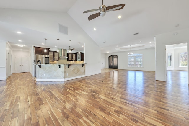 7425 Willow Leaf Cir, Roanoke, VA 24018 - unfurnished living room featuring light wood-style flooring, a ceiling fan, high vaulted ceiling, and recessed lighting