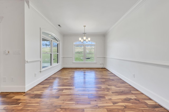 7425 Willow Leaf Cir, Roanoke, VA 24018 - spare room with a chandelier, wood-type flooring, baseboards, and crown molding