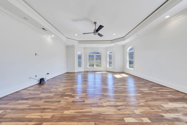 7425 Willow Leaf Cir, Roanoke, VA 24018 - unfurnished living room with light wood-type flooring, a ceiling fan, a tray ceiling, baseboards, and crown molding