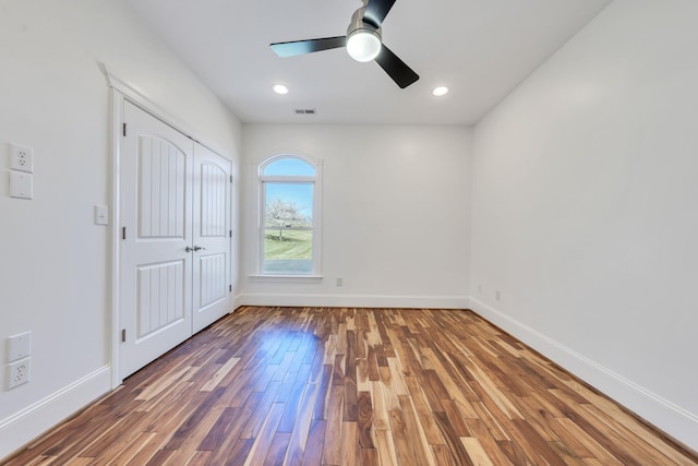 7425 Willow Leaf Cir, Roanoke, VA 24018 - unfurnished bedroom with wood finished floors, baseboards, a ceiling fan, recessed lighting, and a closet