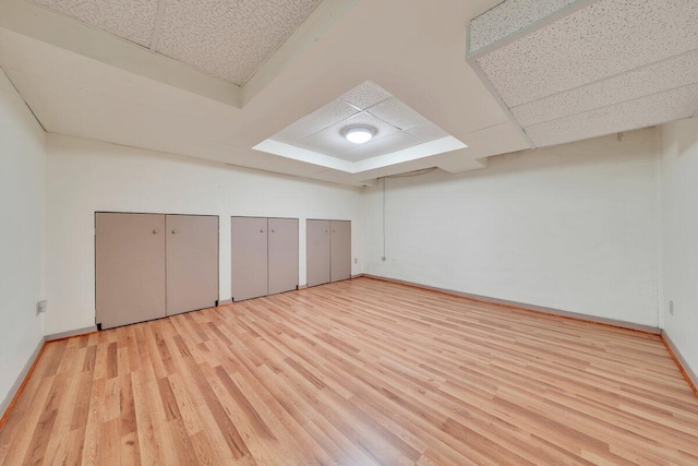 bonus room featuring wood finished floors and baseboards