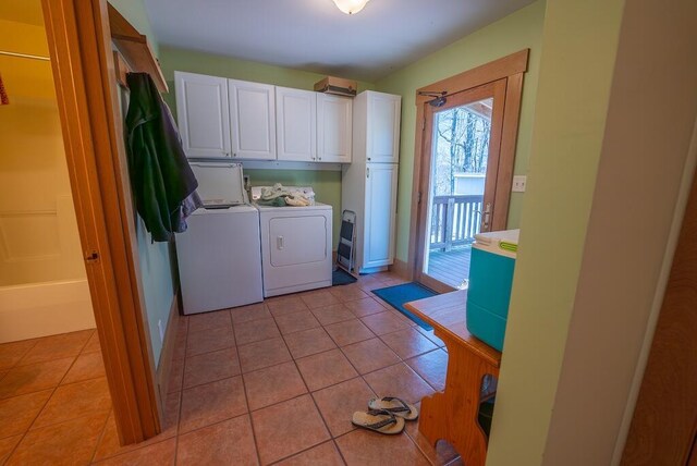 475 Loss Bent Rd NW, Riner, VA 24149 - washroom featuring washer and dryer, cabinet space, and light tile patterned floors