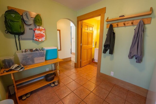 475 Loss Bent Rd NW, Riner, VA 24149 - hallway featuring arched walkways, light tile patterned floors, and baseboards