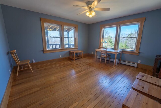 475 Loss Bent Rd NW, Riner, VA 24149 - office area featuring a baseboard radiator, plenty of natural light, hardwood / wood-style floors, and a ceiling fan