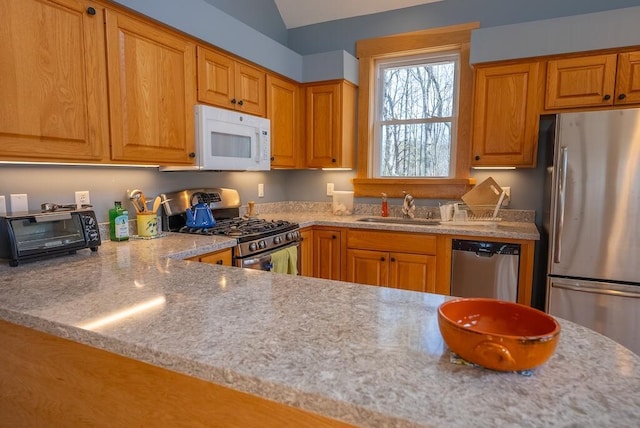 475 Loss Bent Rd NW, Riner, VA 24149 - kitchen with appliances with stainless steel finishes, a sink, brown cabinets, and light stone counters