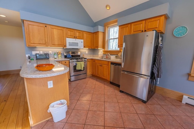 475 Loss Bent Rd NW, Riner, VA 24149 - kitchen featuring stainless steel appliances, a peninsula, light countertops, vaulted ceiling, and a sink