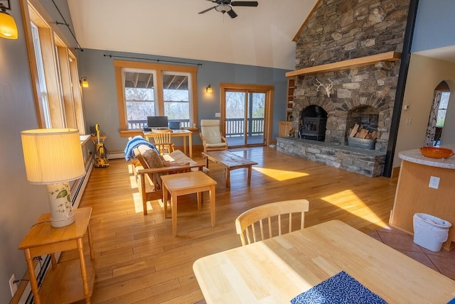 475 Loss Bent Rd NW, Riner, VA 24149 - dining room with a ceiling fan, light wood-style floors, high vaulted ceiling, and baseboard heating