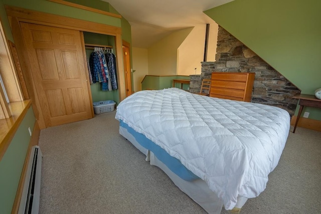 475 Loss Bent Rd NW, Riner, VA 24149 - carpeted bedroom featuring a baseboard heating unit, vaulted ceiling, and a closet