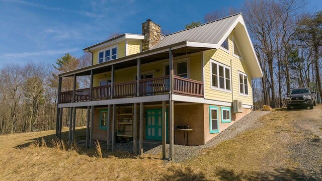 475 Loss Bent Rd NW, Riner, VA 24149 - back of property featuring a chimney, metal roof, and a deck