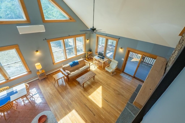 475 Loss Bent Rd NW, Riner, VA 24149 - living area with a wall mounted air conditioner, wood-type flooring, high vaulted ceiling, a ceiling fan, and baseboards