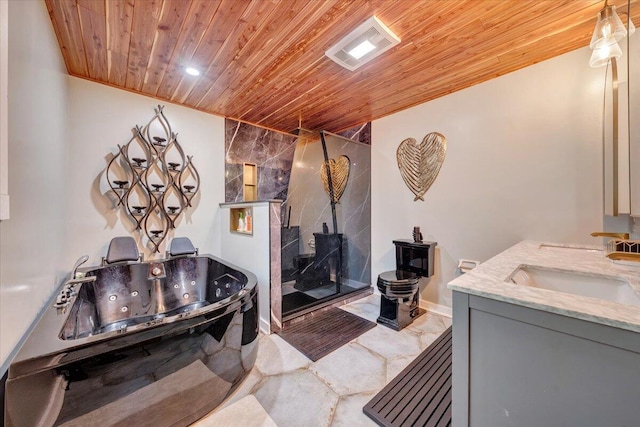 bathroom featuring marble finish floor, a tub with jets, walk in shower, wood ceiling, and a sink