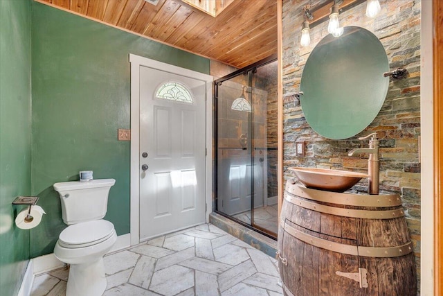 bathroom with vanity, toilet, baseboards, wood ceiling, and a shower stall