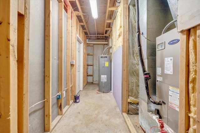 unfinished basement featuring electric water heater