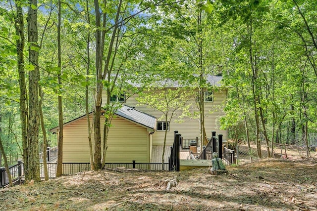 view of property exterior featuring fence