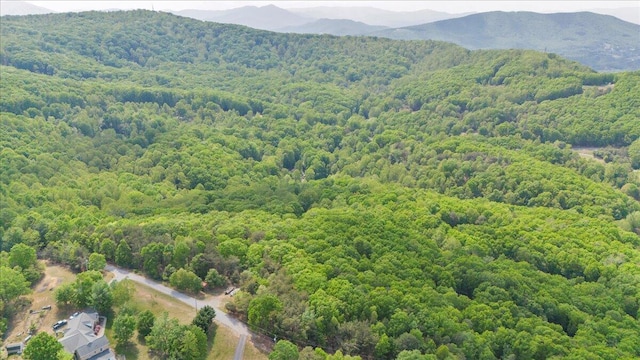 aerial view with a view of trees and a mountain view