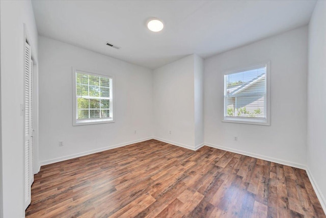 1113 17th St SE, Roanoke, VA 24013 - unfurnished room with baseboards, wood finished floors, and visible vents