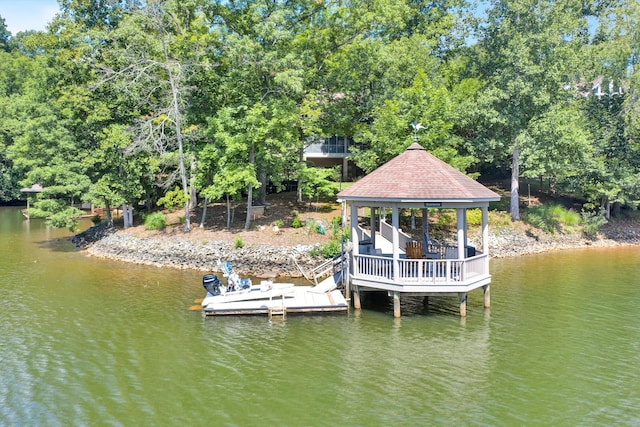 view of dock featuring a water view and a gazebo