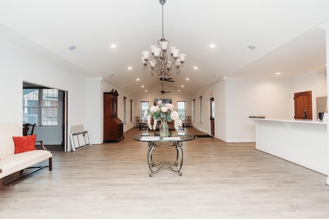dining area with a wealth of natural light, light wood-style flooring, and ornamental molding