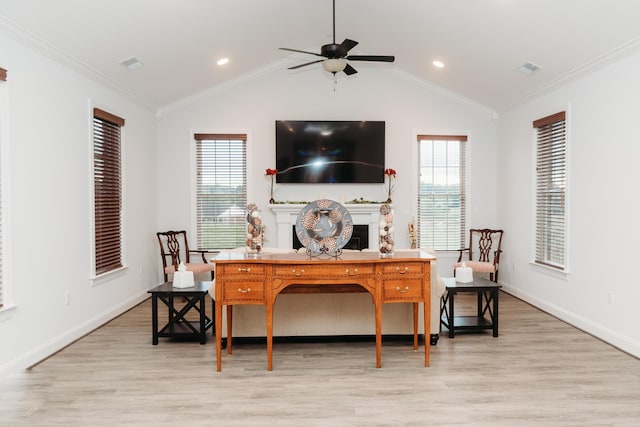 office with light wood finished floors, lofted ceiling, visible vents, ceiling fan, and ornamental molding