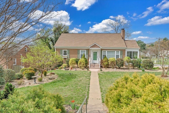 721 Mount Vernon Ave, Salem, VA 24153 - cape cod-style house with a chimney, a front yard, and roof with shingles