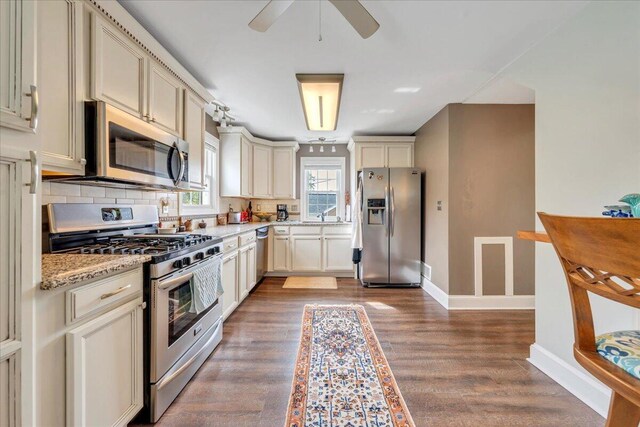 721 Mount Vernon Ave, Salem, VA 24153 - kitchen with baseboards, ceiling fan, wood finished floors, tasteful backsplash, and appliances with stainless steel finishes