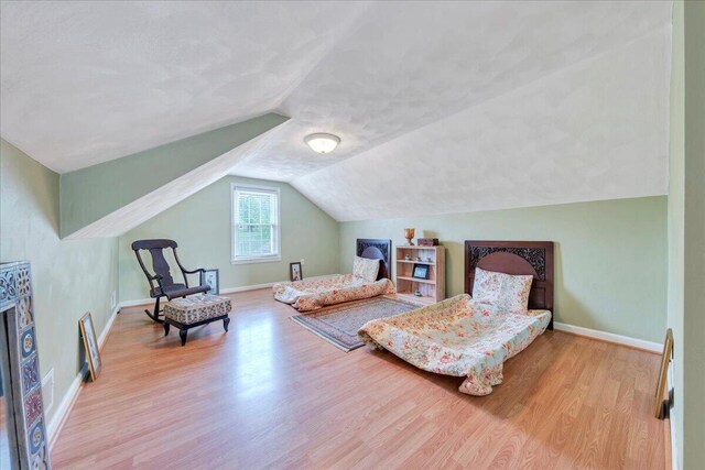 721 Mount Vernon Ave, Salem, VA 24153 - bedroom featuring baseboards, lofted ceiling, and wood finished floors