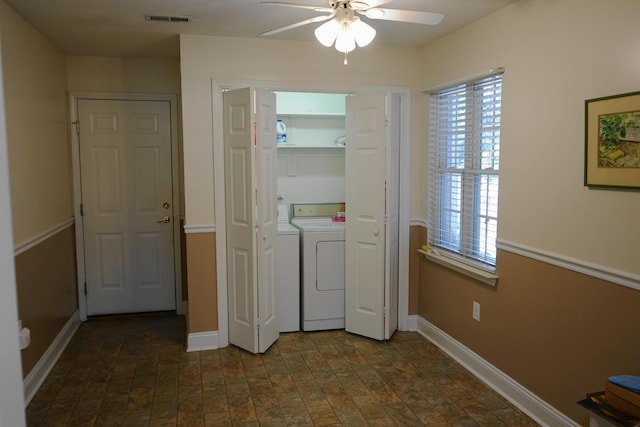 laundry area with washing machine and clothes dryer, ceiling fan, visible vents, baseboards, and laundry area