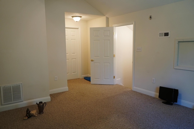 empty room featuring baseboards, visible vents, and carpet flooring