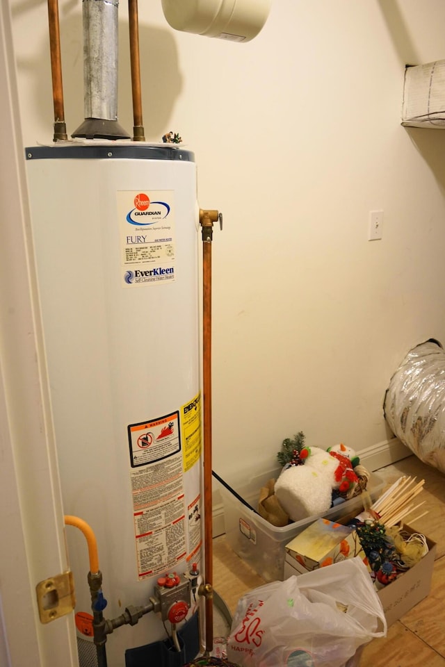 utility room featuring gas water heater