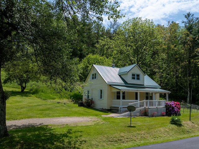 3512 Conner Grove Rd SW, Willis, VA 24380 - view of front facade featuring a porch, a front lawn, metal roof, and cooling unit