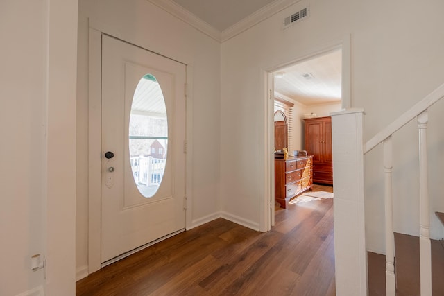 entrance foyer with stairway, baseboards, visible vents, ornamental molding, and dark wood-style flooring